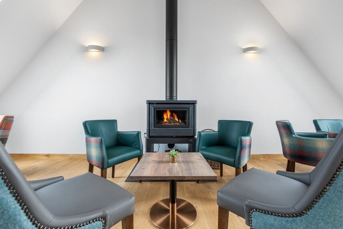 Upstairs seating with log burner at The Sprig Restaurant